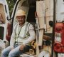 a field service contractor sits in a van
