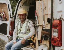 a field service contractor sits in a van