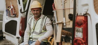 a field service contractor sits in a van