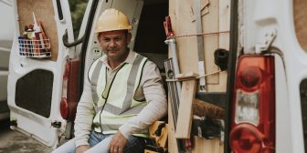 a field service contractor sits in a van