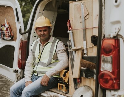 a field service contractor sits in a van