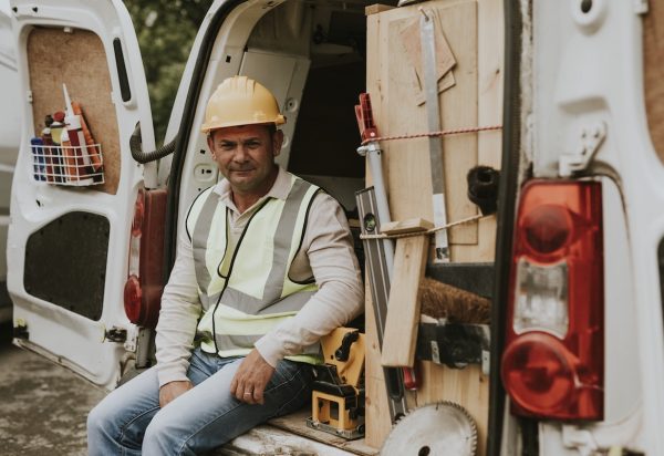 a field service contractor sits in a van