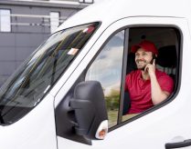 high-angle-delivery-service-man-talking-phone