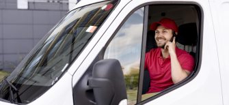 high-angle-delivery-service-man-talking-phone