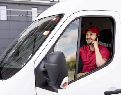 high-angle-delivery-service-man-talking-phone