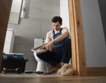 male-plumber-working-fix-problems-client-s-house