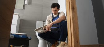 male-plumber-working-fix-problems-client-s-house