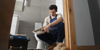 male-plumber-working-fix-problems-client-s-house
