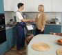 a plumber shakes hands with a plumbing lead that now is a customer