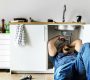 Plumber man fixing kitchen sink