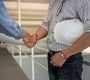 professional-engineering-team-with-white-helmet-shaking-hands-each-other