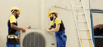 African american mechanic and apprentice repairman taking apart old damaged external hvac system to replace it with new performant air conditioner after draining refrigerant and replacing ductwork SSUCv3H4sIAAAAAAAAA41QS47DIAy9C+sgkRDI5yqjWRhwWtQ0VECmqqLcfUyaarbDyvYzfp+NecdGNhmhajtM3BireQui41Dricuu6QQKi7JxrGIOMrKxllJL3fdyqFUrBb2KGUjesnFjfp7XlCNkHxY2EhJxcRiPEp3PIXqYqdsrljLkNWGib9RZun0h9Og/9762MieBRJ5WU4q9+ufsu2JwwcW+yv29CJkRDrov5pTWXd3XvDMOeCv6gQ8KBBcAaui1aoamp1N9A602BEoUDcXSKQ4CJy6cNarGYl0y4rk9M8b7aSTka/FLisK65Ph6q5pDeICZKb4J5oQVu0JKtODOAX18RG/9cjnjoBTD/V0vIRfZh7kc7M27k+qd4NXTtPBsbH3MARy6E17N3ef8aSP+eHz+be/7/gvxX5z8/wEAAA==