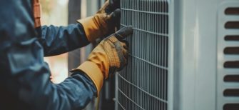 Technician checks the air conditioner system technician gloves hvac.