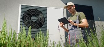 an hvac technician uses a mobile tablet next to an air conditioning unit. The text reads customer story: Guidry’s Air Conditioning & Refrigeration Service