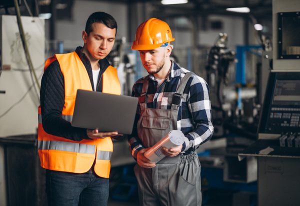 Two colleagues at a factory